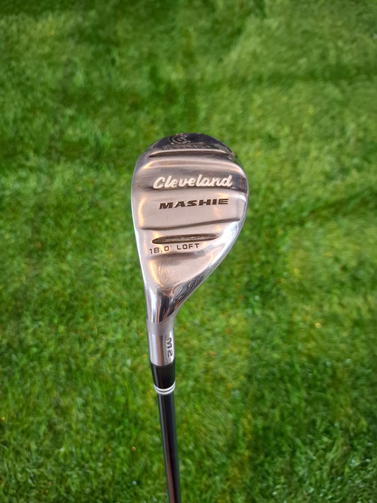 Golf club with Cleveland branding on a grass background